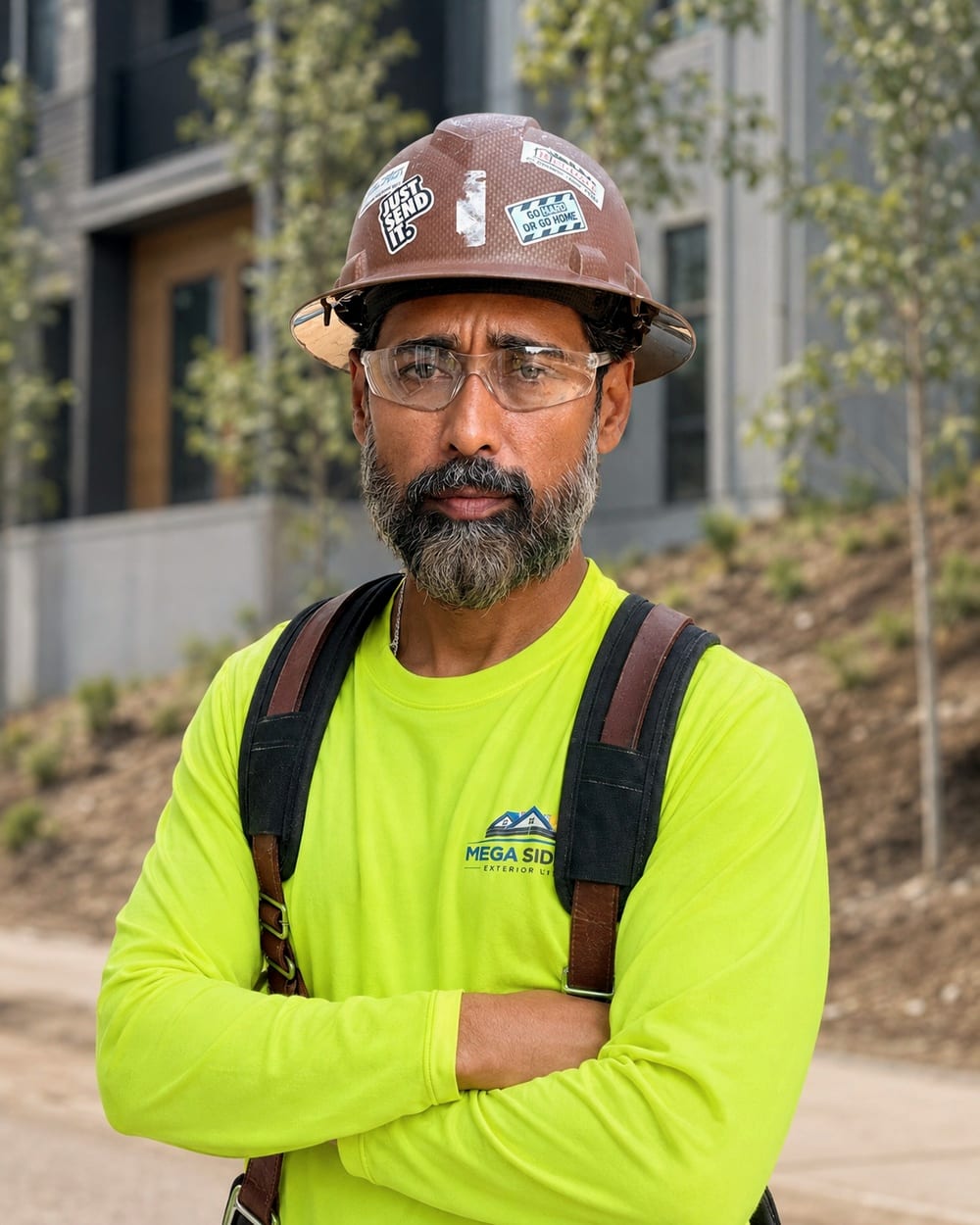 Amir, owner and founder of Mega Siding Exterior Ltd., on a job site in British Columbia